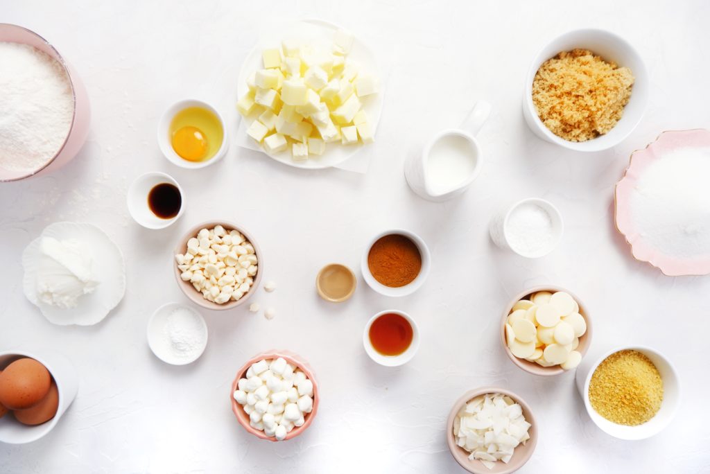 flour, sugar, butter, and other ingredients used in baking in bowls