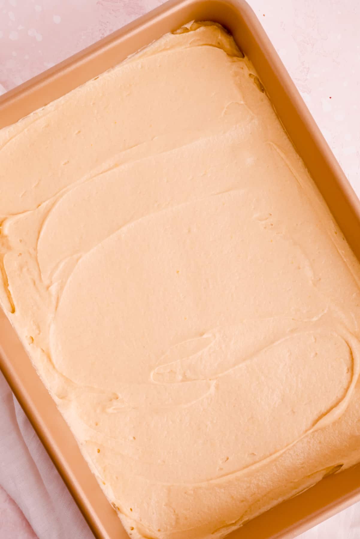 batter for an easy vanilla sheet cake in a 9" x 13" pan ready to bake