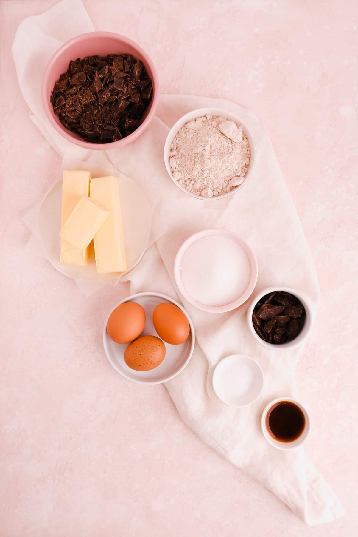 portioned ingredients shown in bowls needed for making fudgy gluten free brownies from scratch
