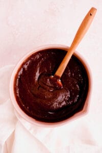 fudgy gluten free brownie batter in a bowl with a spatula