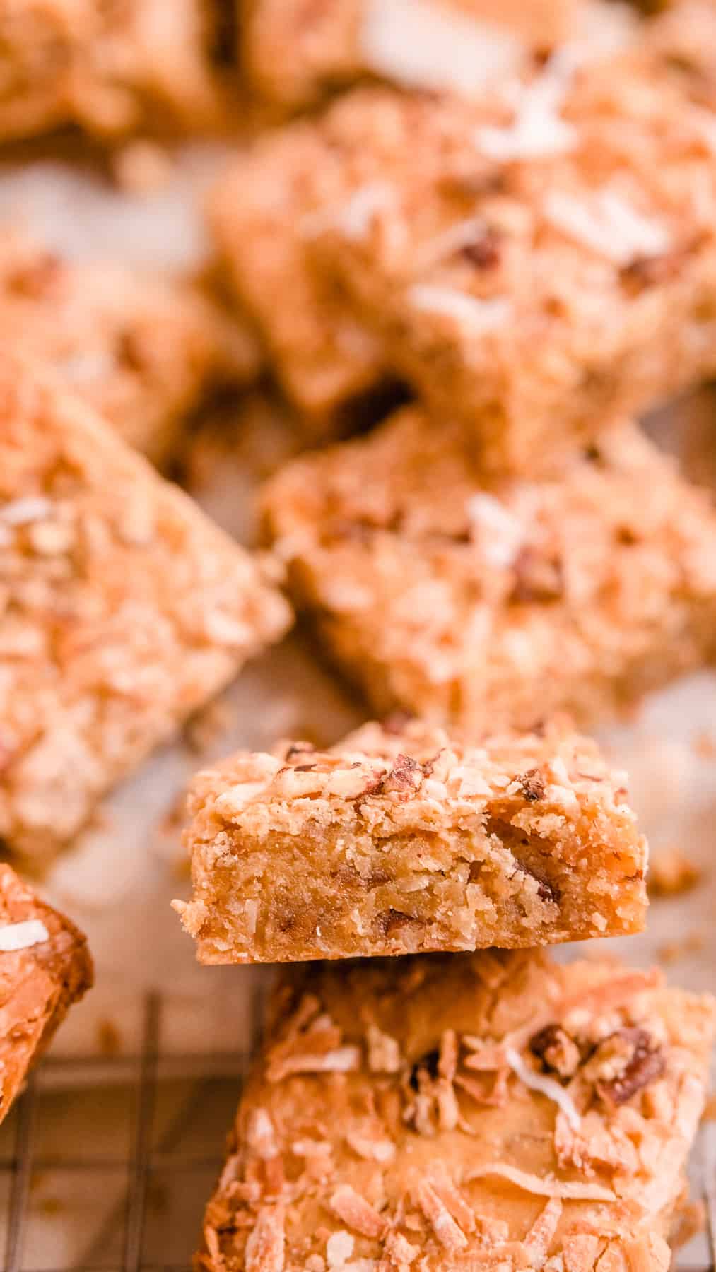 coconut butterscotch cookie bars on a wire rack