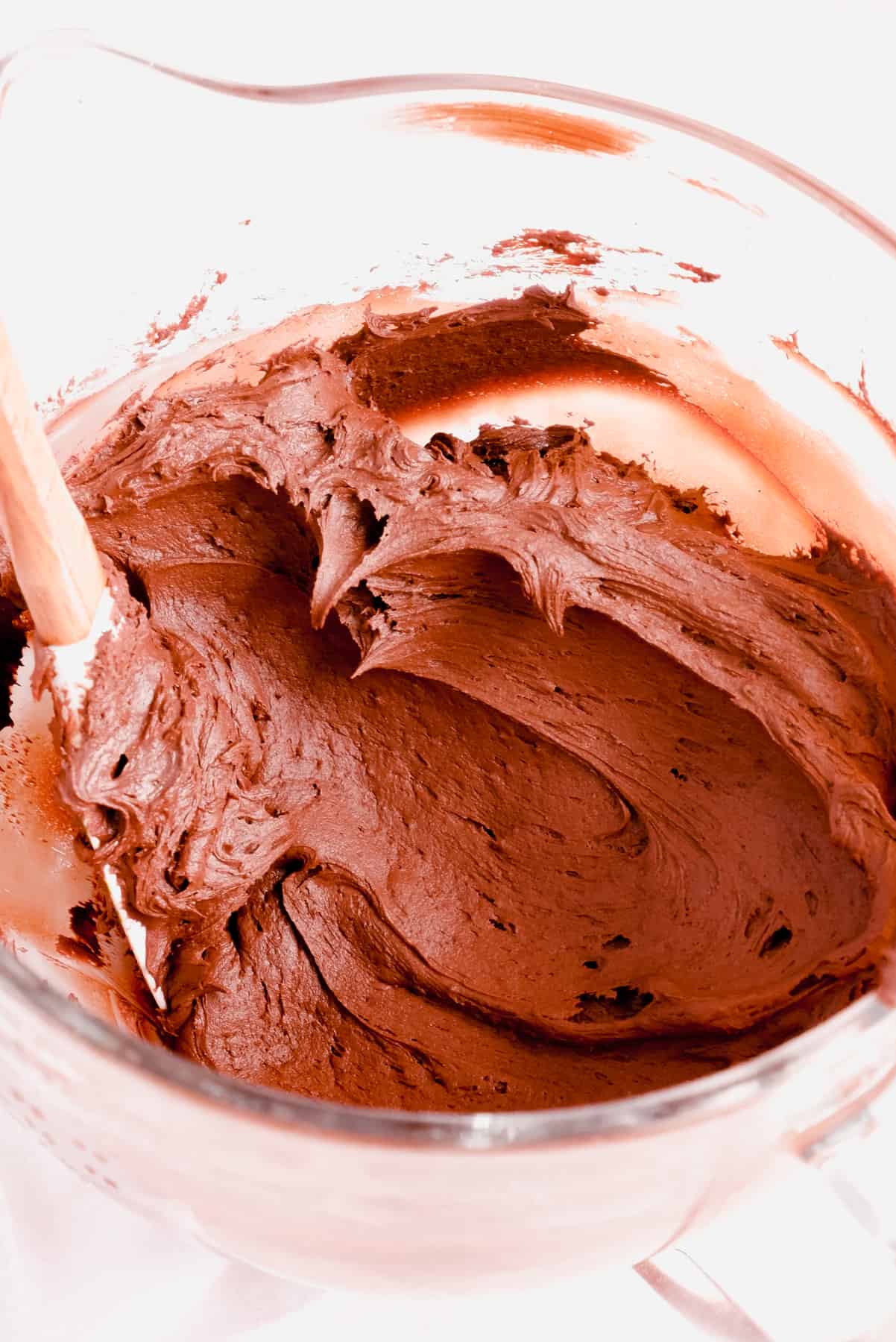 a bowl of chocolate buttercream frosting