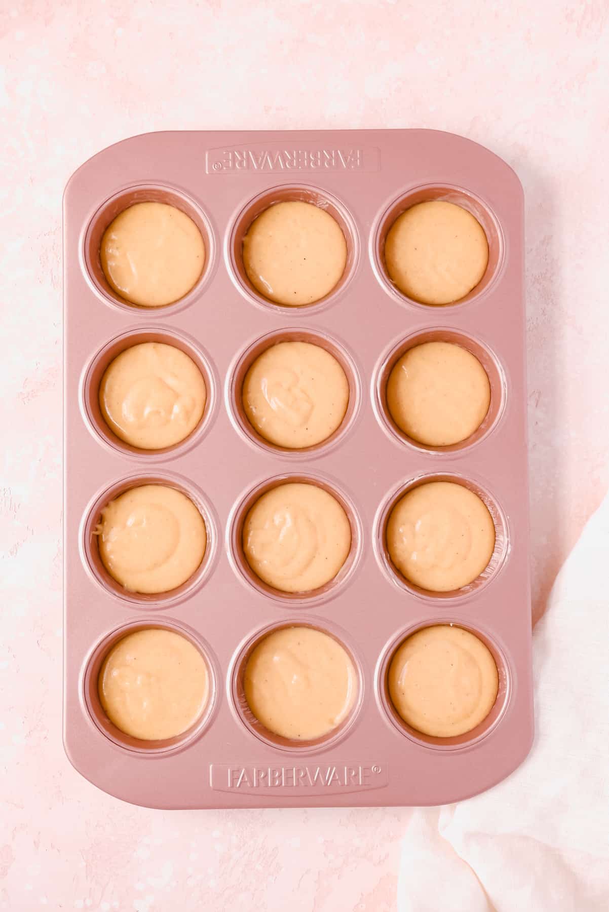 Cinnamon Donut Muffin batter in a pan