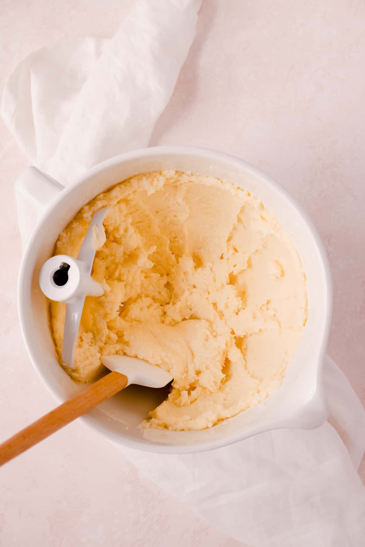 lemon bundt cake batter in a bowl with a spatula