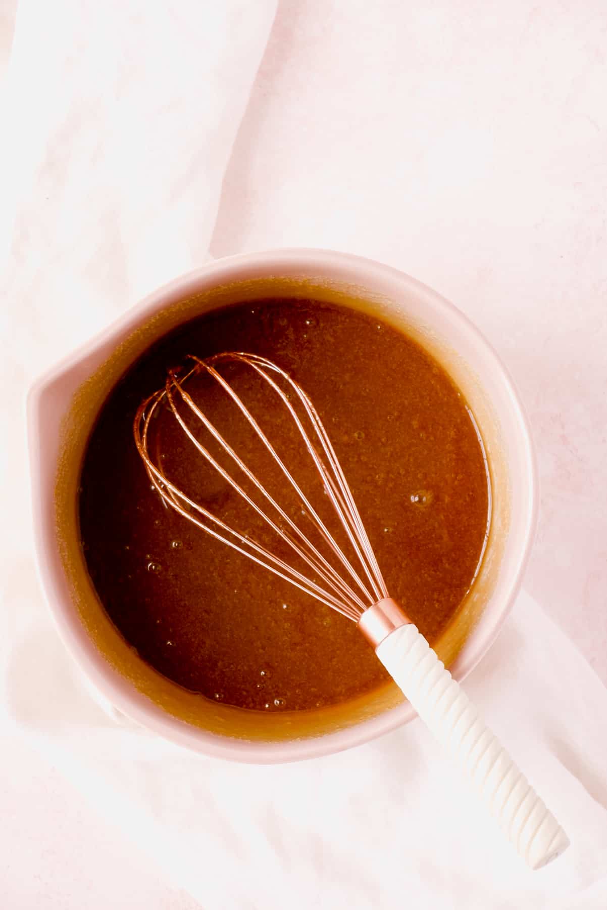 a bowl of coconut butterscotch cookie bar batter