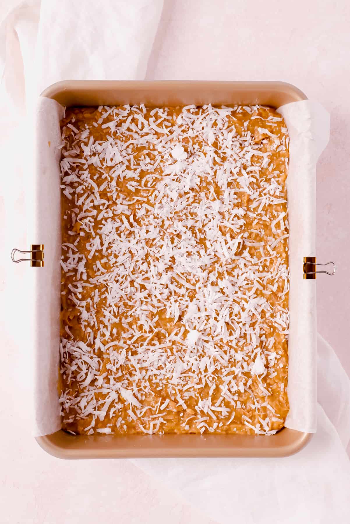 unbaked coconut butterscotch bars in a 9"x13" pan