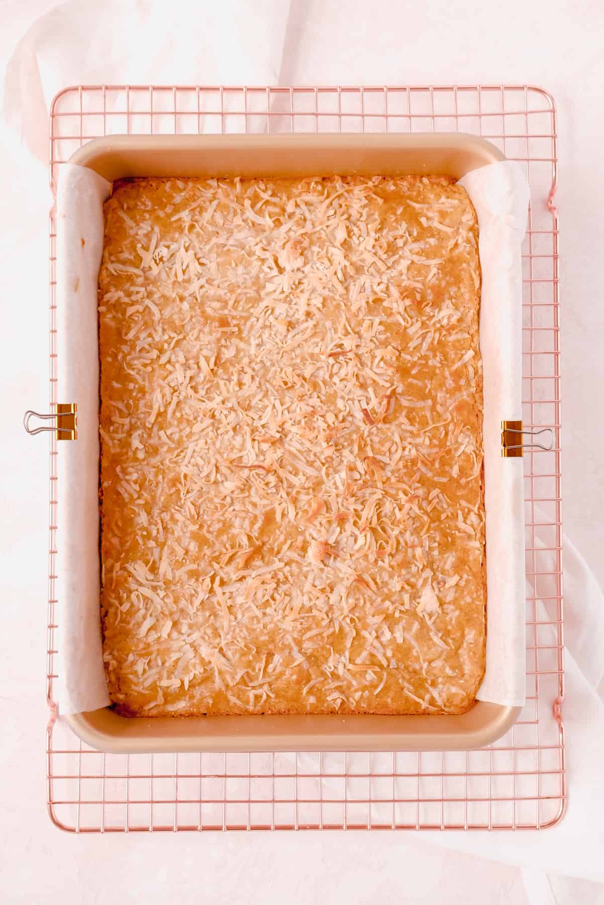 coconut butterscotch bars in a 9"x13" pan on a wire rack