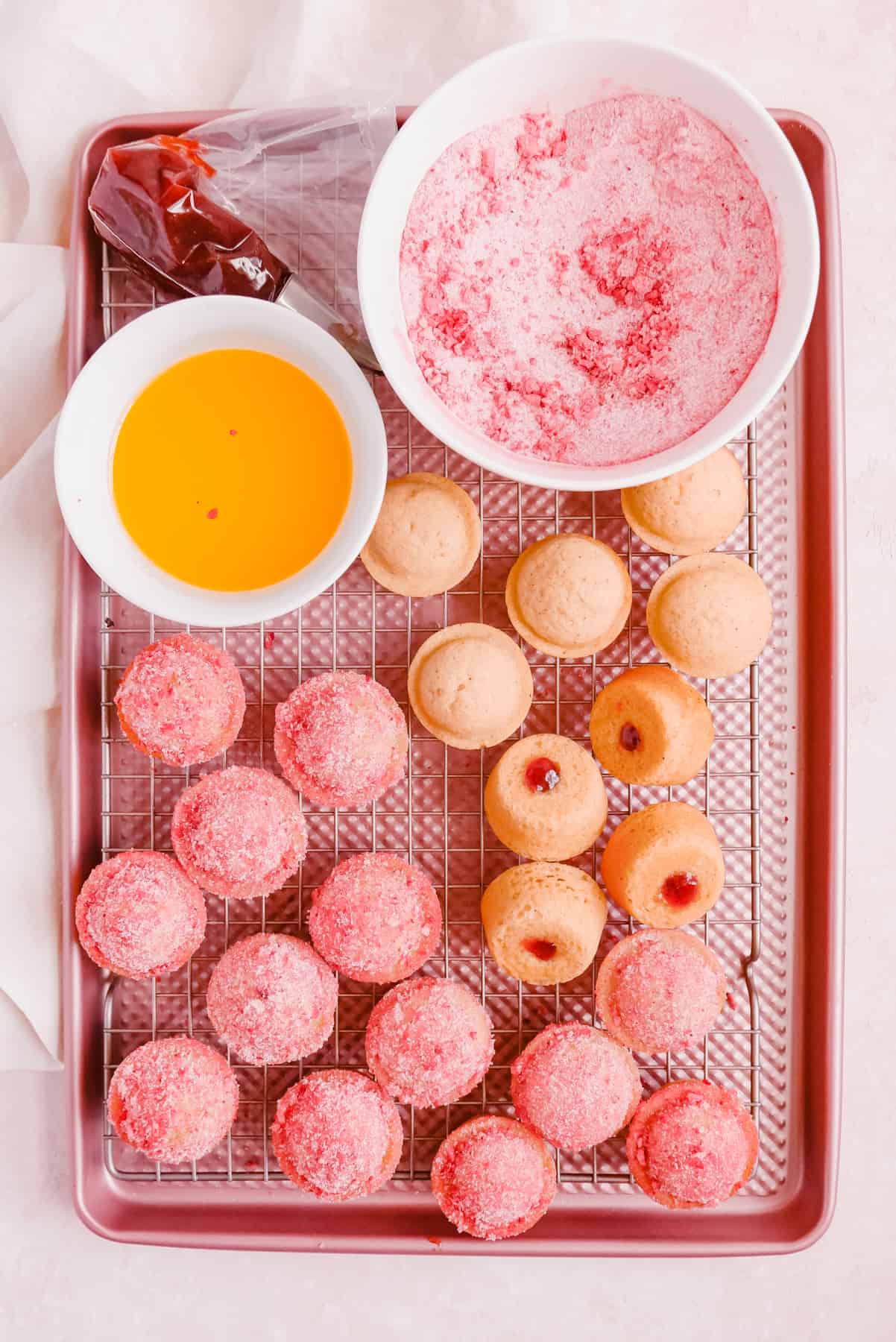 Strawberry Jam-Filled Donut Muffins on a cooling rack