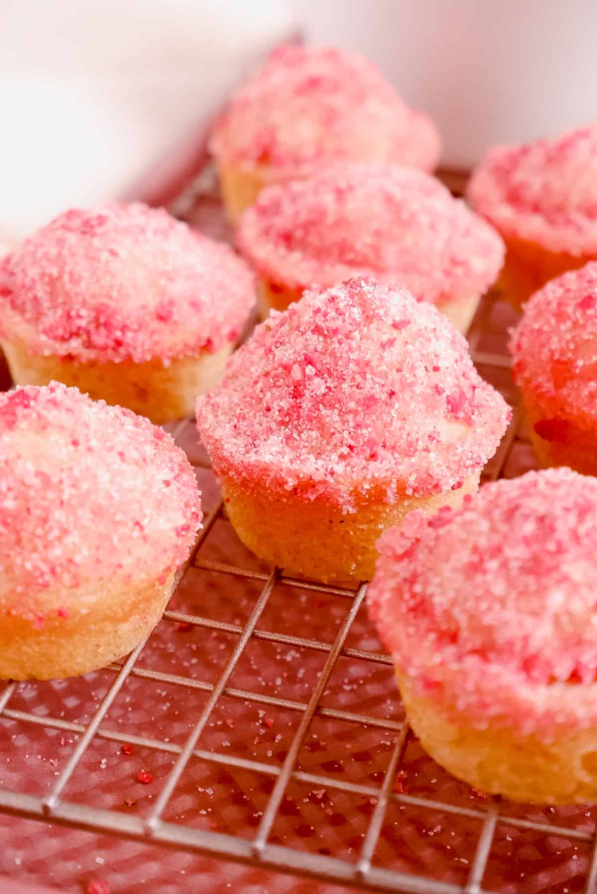 Strawberry Jam-Filled Donut Muffins on a cooling rack