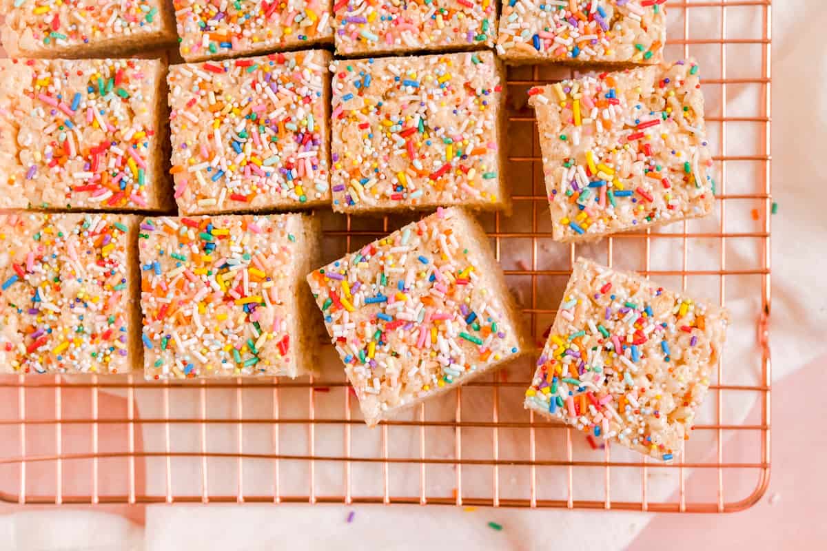 Brown Butter Rice Krispie Treats with sprinkles on top on a wire rack