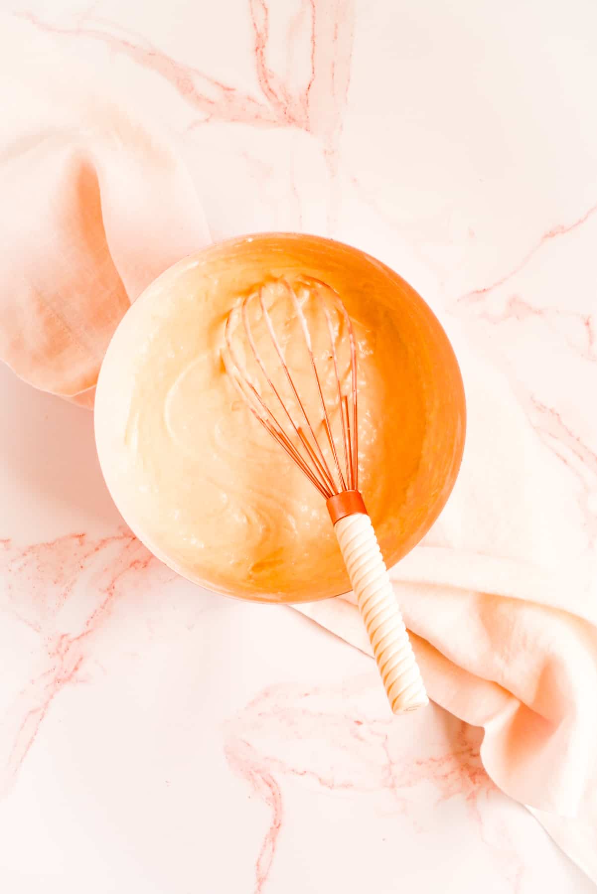 buttermilk pancake batter in a bowl with a whisk
