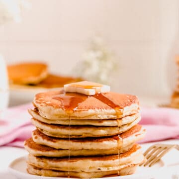 Fluffy Buttermilk Pancakes with butter and syrup on a small plate