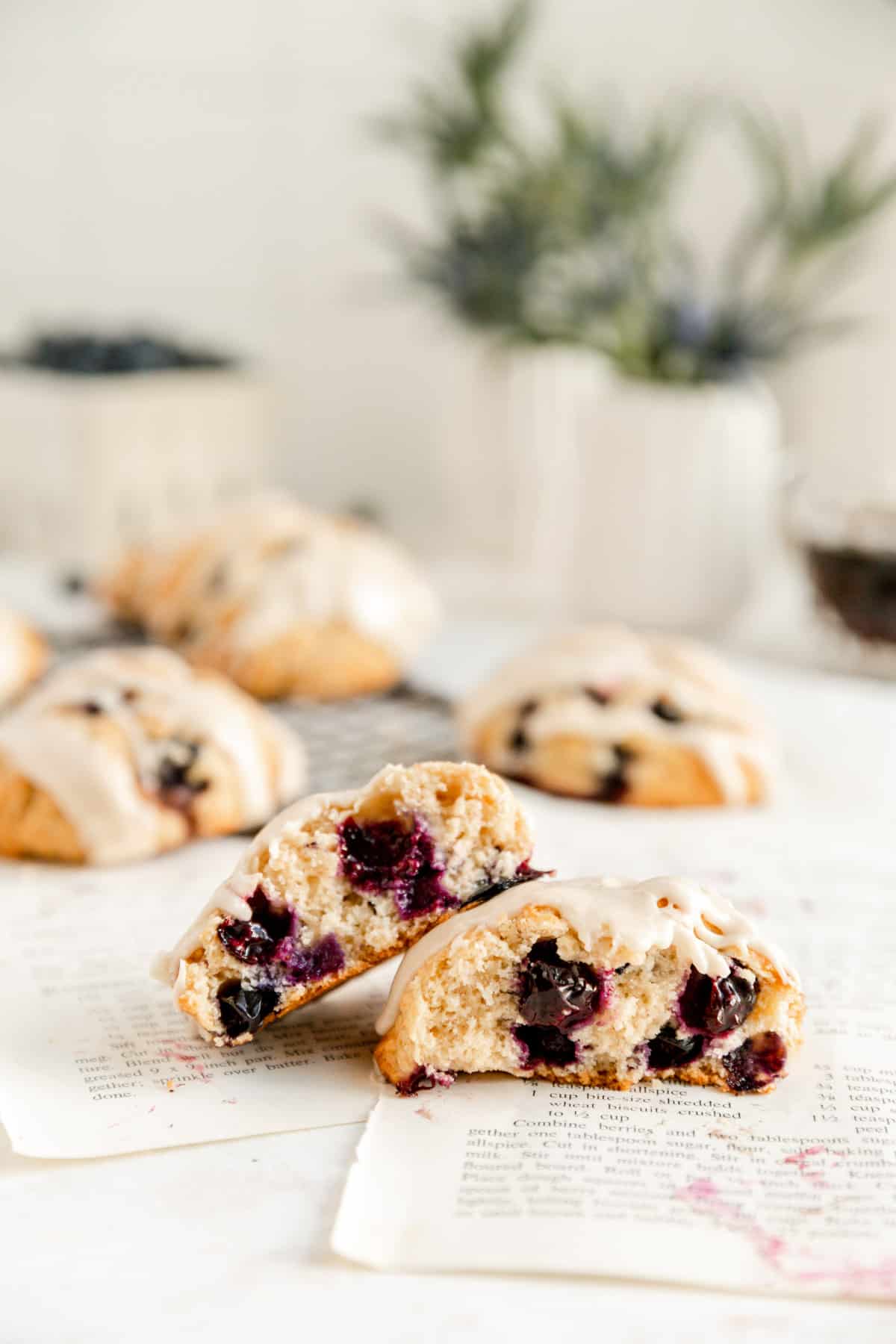 two stacked scone halves showing the inside filled with blueberries on recipe pages