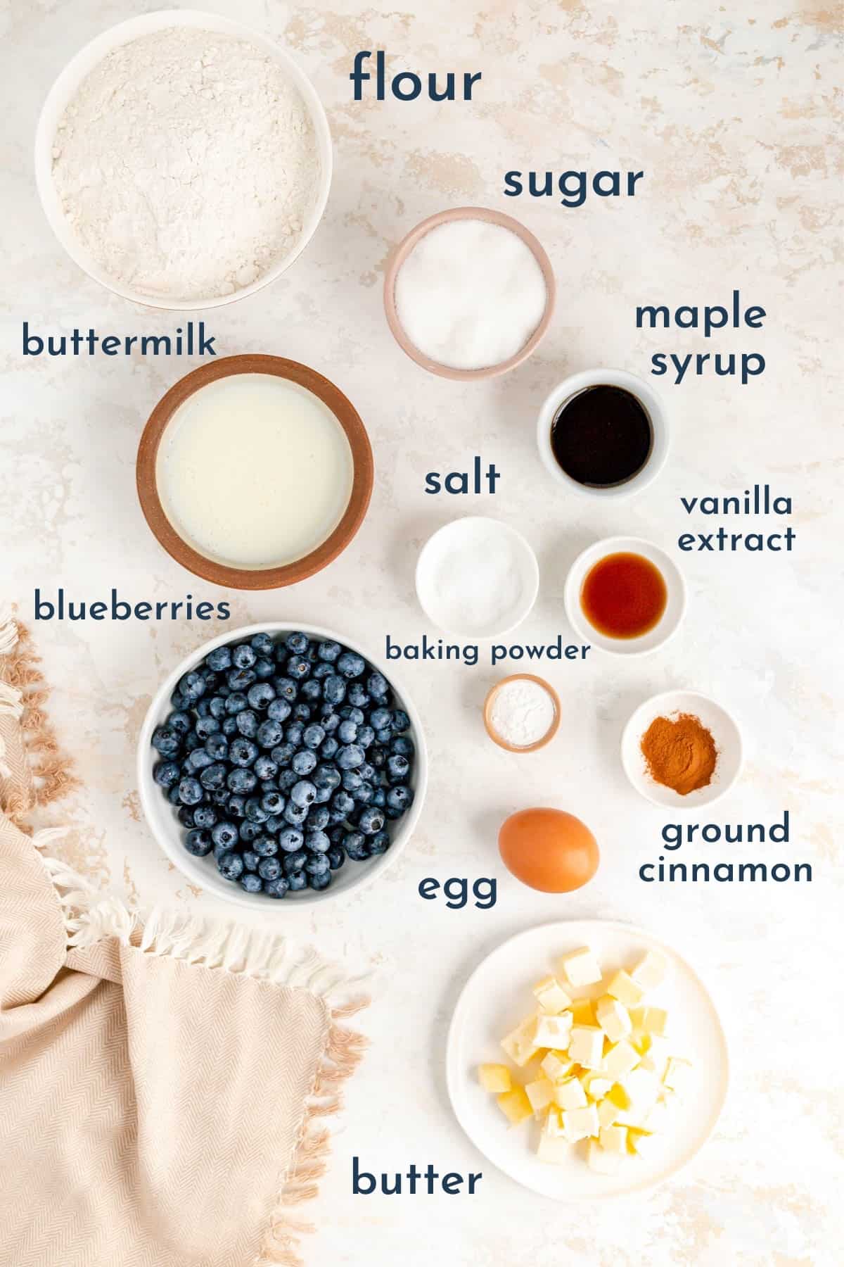 labeled bowls of ingredients for making maple blueberry drop scones