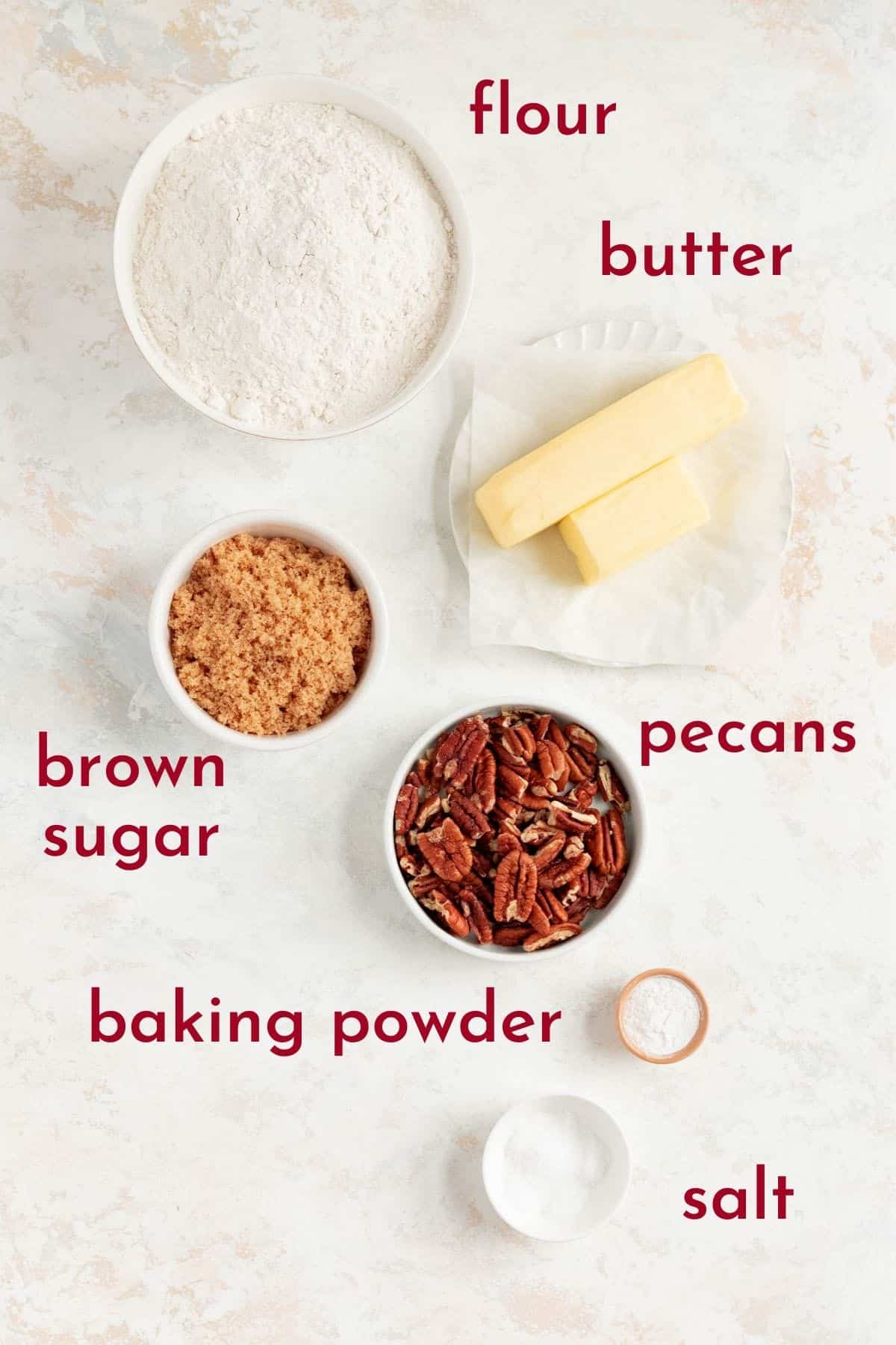 flour, butter, brown sugar, pecans, baking powder, and salt in individual bowls.