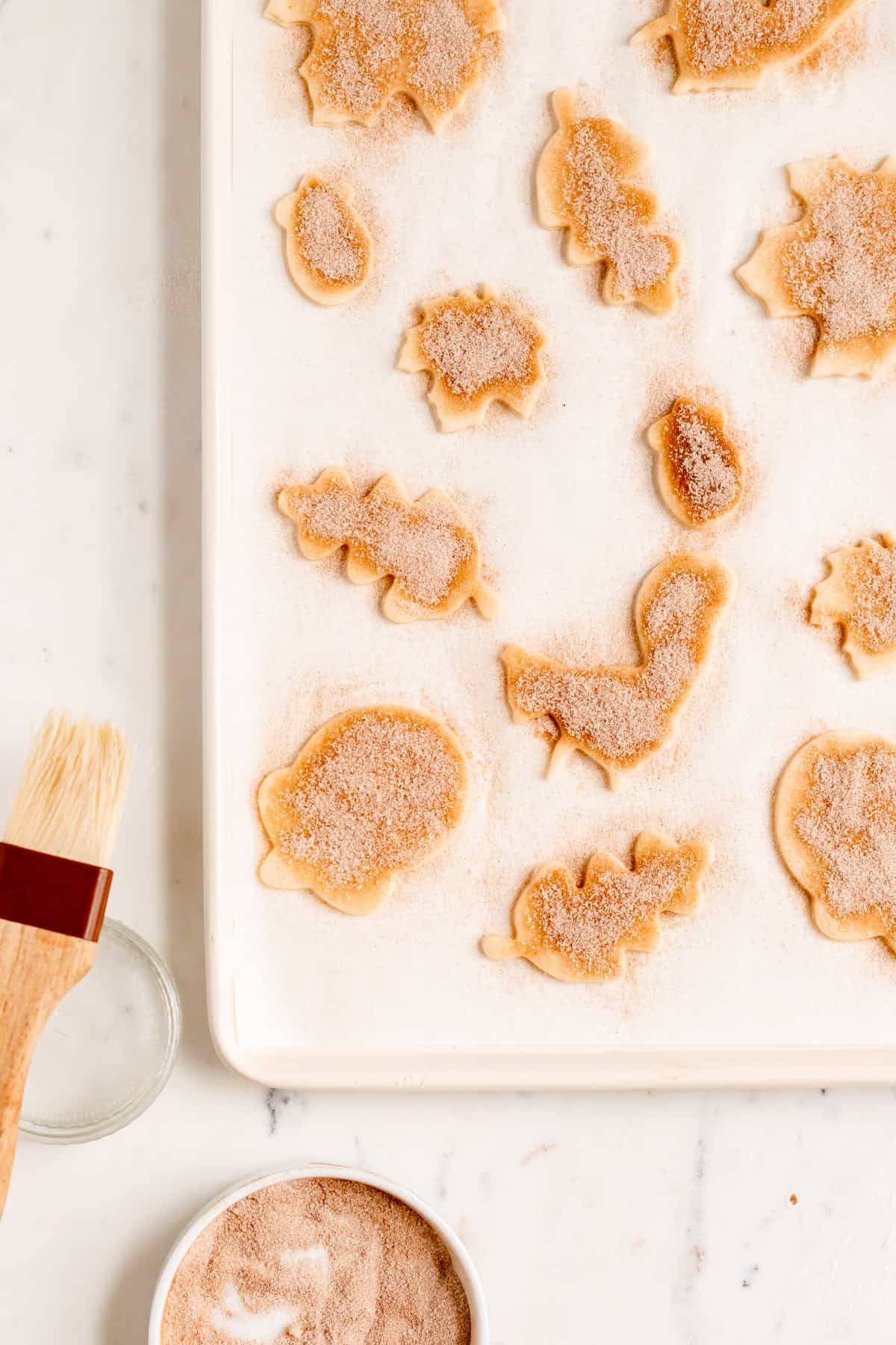 fall-shaped pie crust cookies with cinnamon and sugar on top