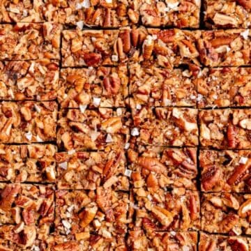 close up of sliced salted pecan pie bars