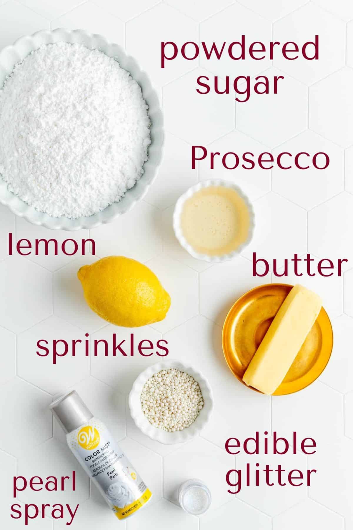 Ingredients for decorating Prosecco cupcakes in individual bowls on white background.