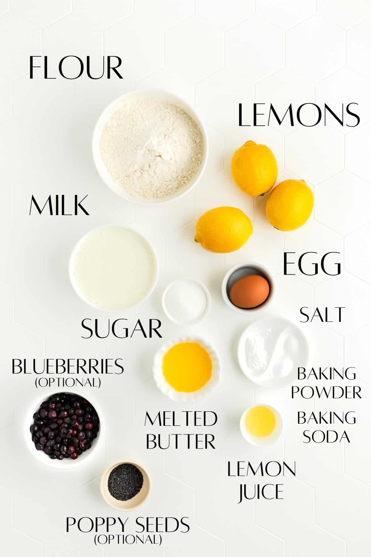 Ingredients for lemon pancakes in individual balls on white background.
