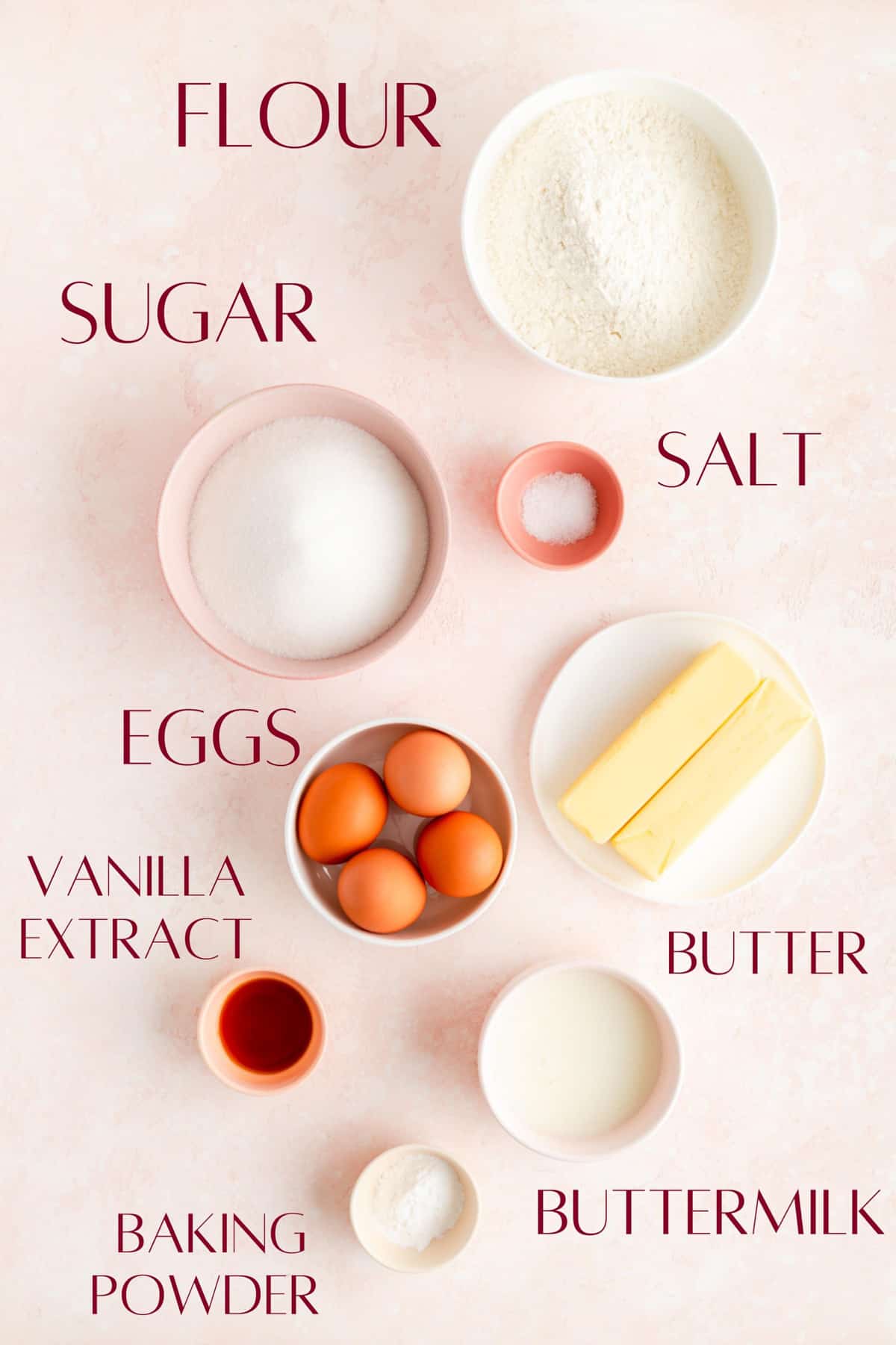 Ingredients for easy vanilla sheet cake in individual bowls on pink background.