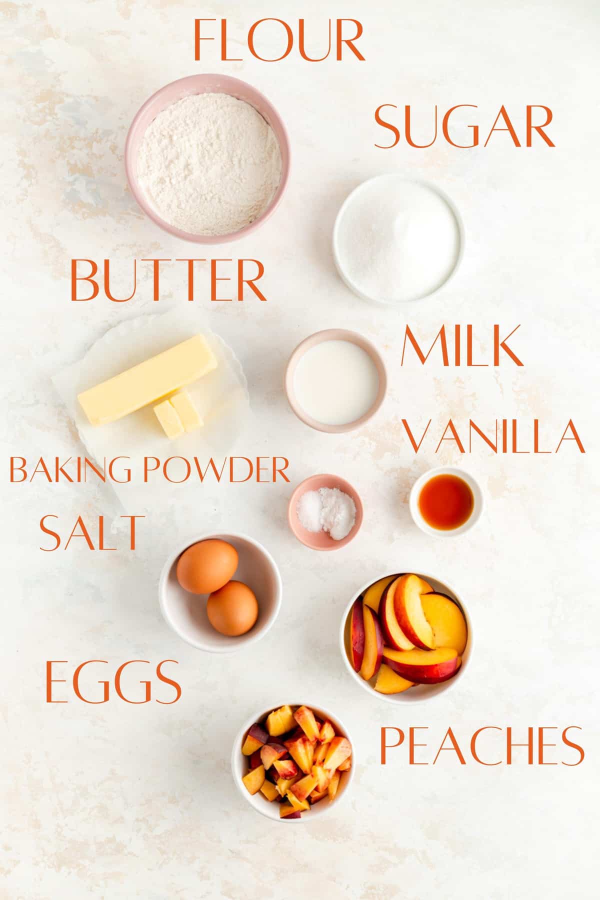 ingredients for peach pound cake in individual bowls on white background.