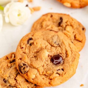 Close up of stacked chocolate chip peanut butter cookies with big molten chocolate chip.