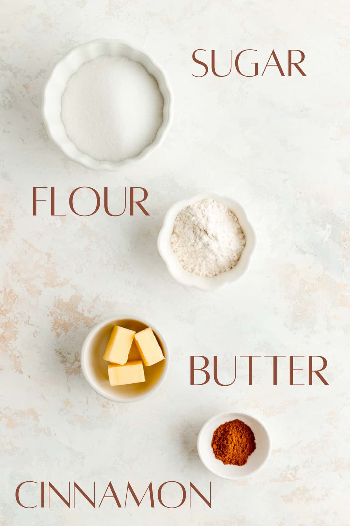 sugar, flour, butter, and cinnamon in individual bowls.