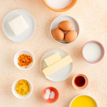 eggs, cream cheese, butter, orange zest, lemon zest, vanilla, salt, and milk in individual bowls.